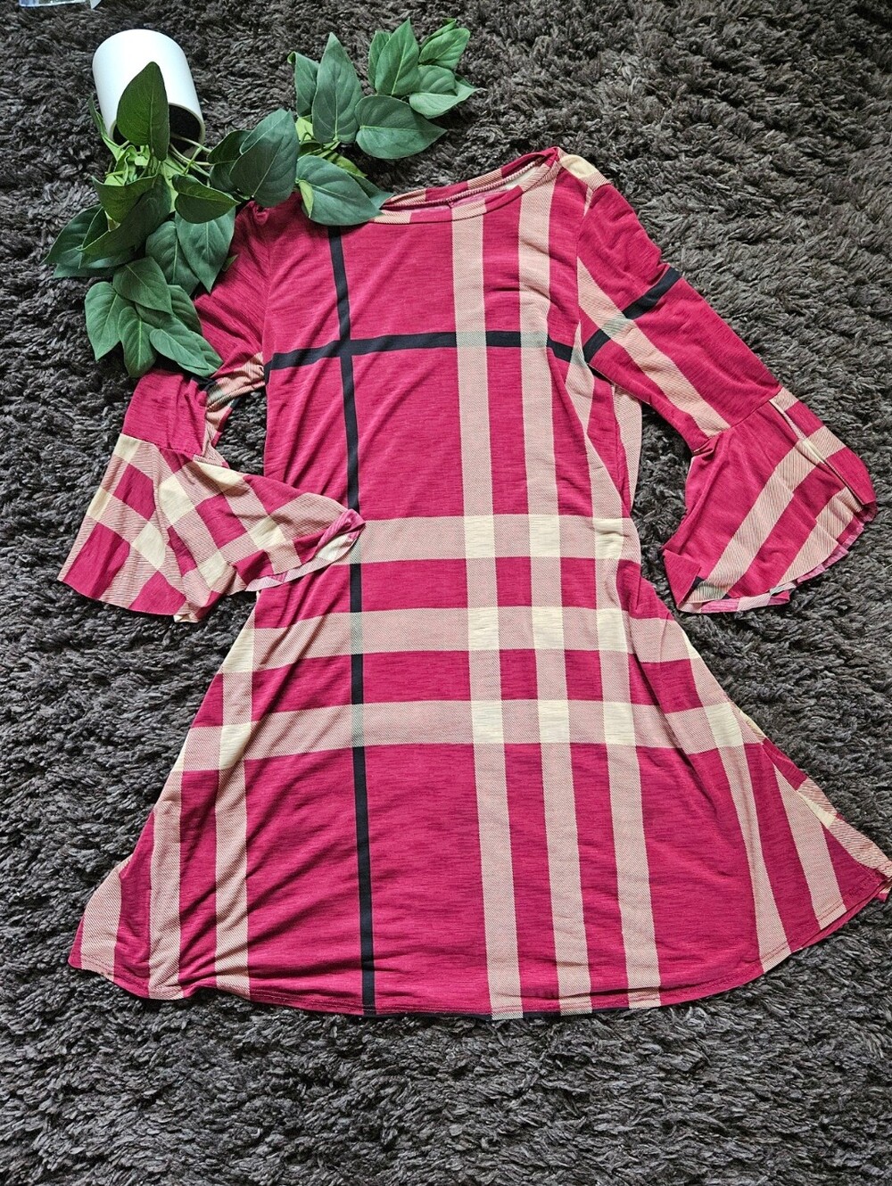 Red burgundy plaid mini dress featuring a classic "Nova Check" style pattern.It